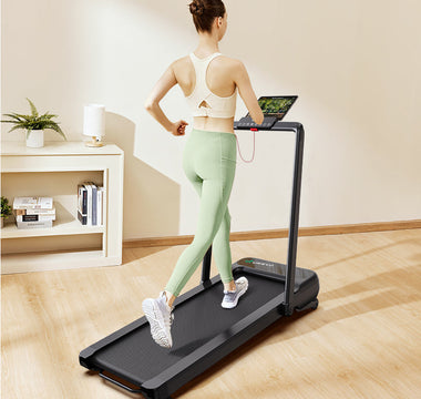 A woman running on a UREVO Strol 2S Pro Treadmill in a cozy home setting.