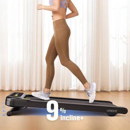 A woman running on a treadmill set at a 9% incline in a room.