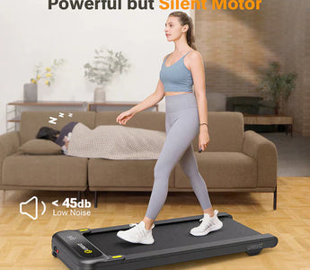 Woman walking on a treadmill with a sleeping person nearby, highlighting the silent motor.