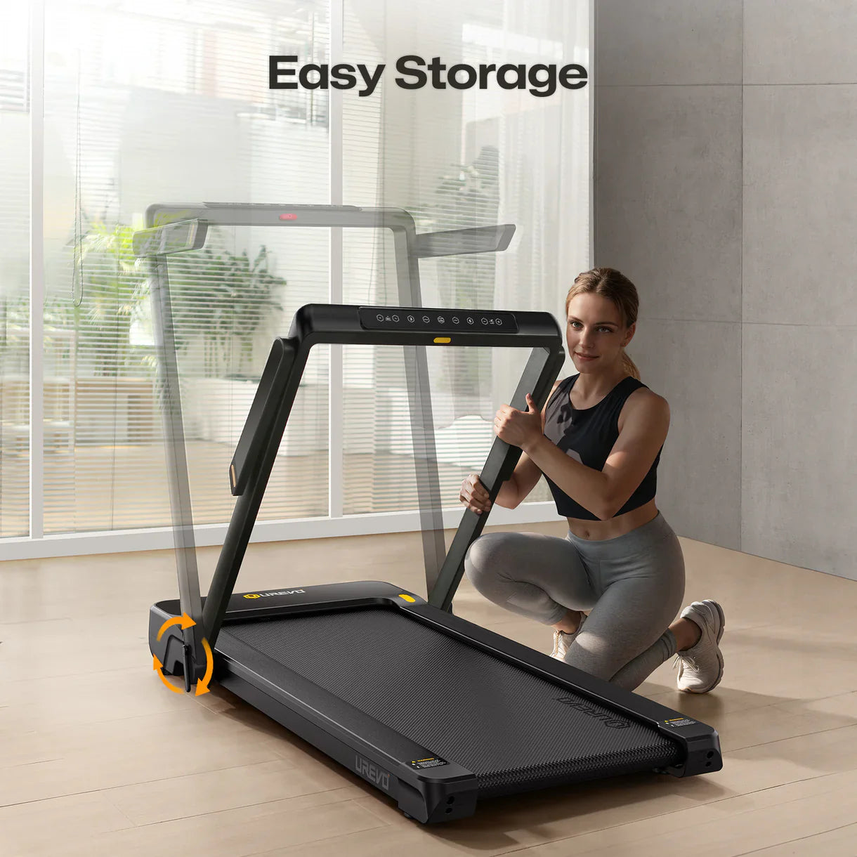 A woman is kneeling next to a UREVO Strol 1 Pro treadmill, demonstrating its easy storage feature in a modern living space.