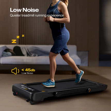 A woman is running on a quiet treadmill in a living room, with a person sleeping on a sofa in the background.