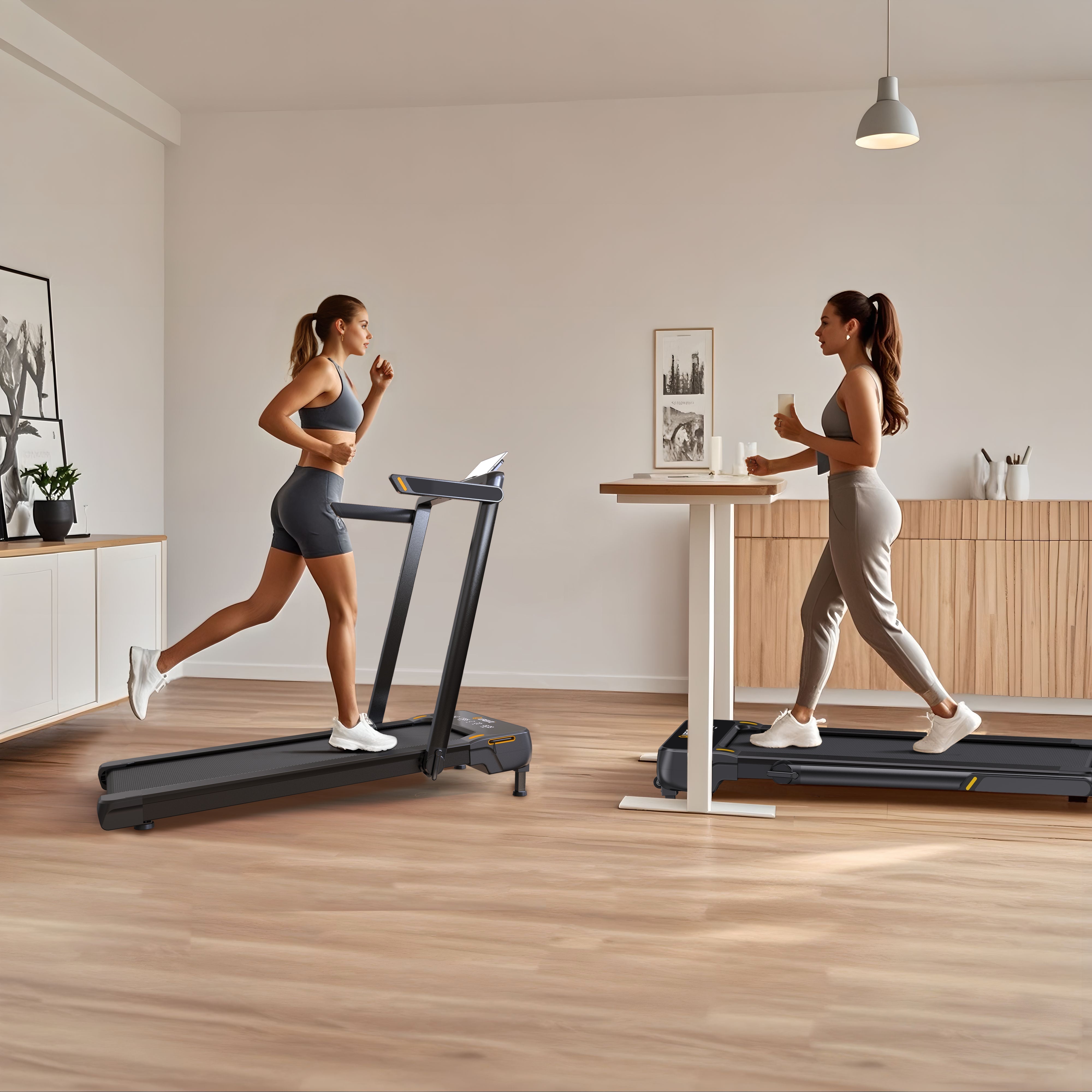 Two women are exercising on treadmills in a modern, minimalist room with wooden floors