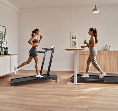 Two women are exercising on treadmills in a modern, minimalist room with wooden floors